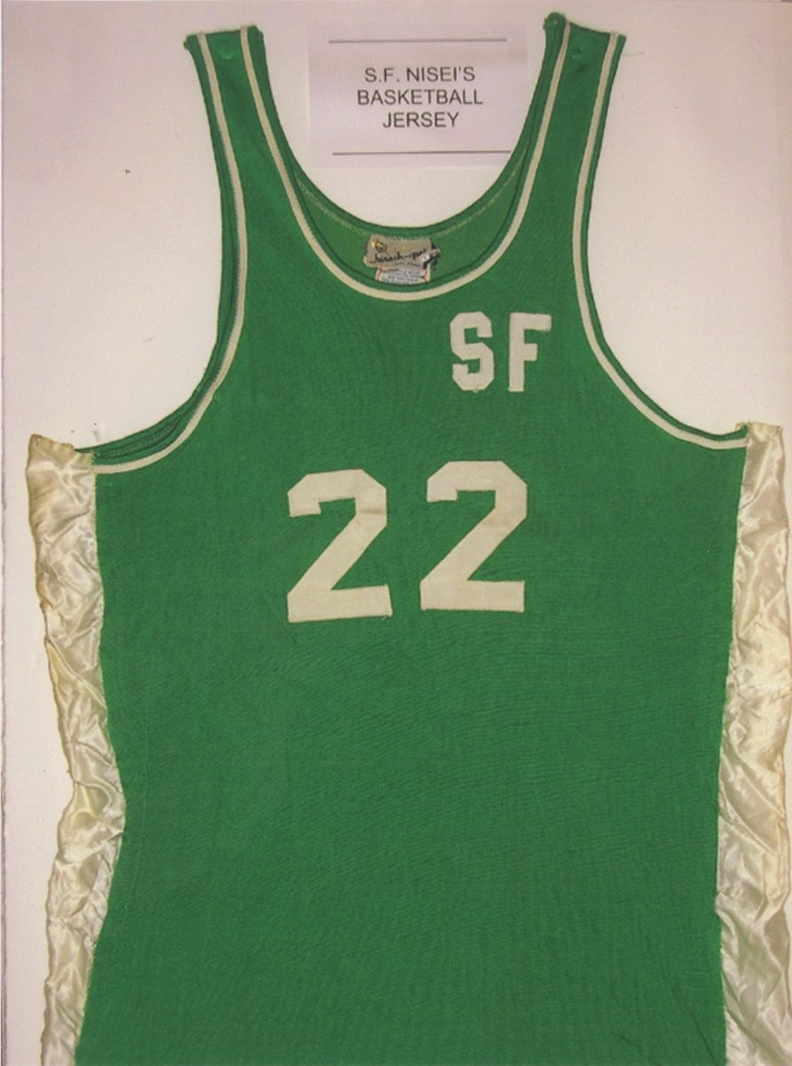 A green basketball jersey with “SF 22” in white letters.