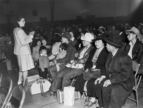 Briefing of evacuees in the Buchanan-Japanese YMCA gym